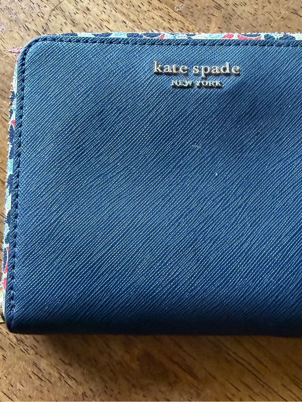 kate spade navy blue compact wallet with floral trim